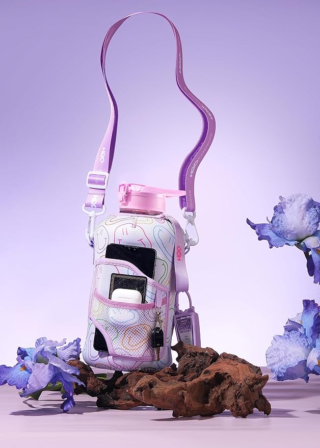 H2O Capsule 2.2L Half Gallon Water Bottle with Storage Sleeve and Removable Straw – BPA Free Large Reusable Drink Container with Handle - Big Sports Jug, 2.2 Liter (74 Ounce), Purple Smiley