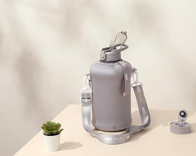 H2O Capsule 2.2L Half Gallon Water Bottle with Storage Sleeve and Covered Straw Lid – BPA Free Large Reusable Drink Container with Handle - Big Sports Jug, 2.2 Liter (74 Ounce)