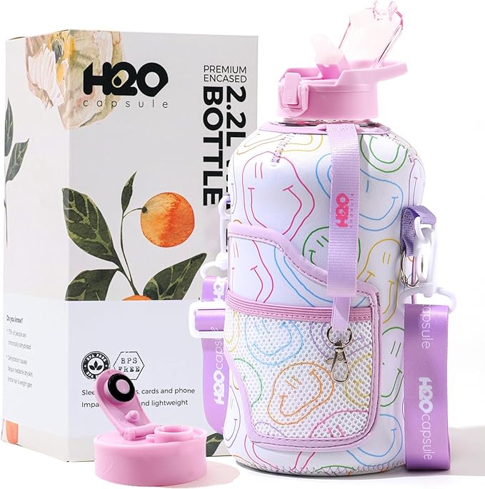 H2O Capsule 2.2L Half Gallon Water Bottle with Storage Sleeve and Removable Straw – BPA Free Large Reusable Drink Container with Handle - Big Sports Jug, 2.2 Liter (74 Ounce), Purple Smiley